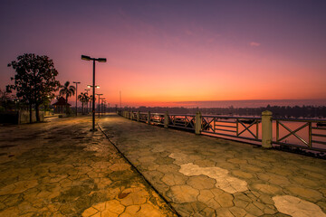 The background of the sea by the evening sea, with natural beauty (sea water, rocks, sky) and fishermen are fishing by the river bank, is a pleasure during travel.