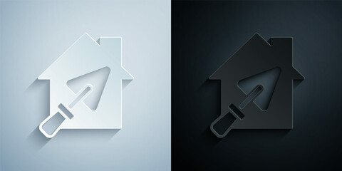 Paper cut House or home with trowel icon isolated on grey and black background. Adjusting, service, setting, maintenance, repair, fixing. Paper art style. Vector