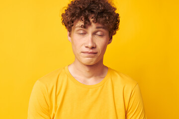 portrait of a young curly man Youth style studio casual wear isolated background unaltered