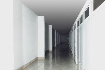 Modern empty office corridor with white walls