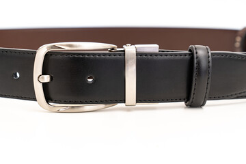 part of Double-sided black and brown leather belt on a white background.