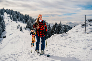 Mountaineer backcountry ski walking ski woman alpinist in the mountains. Ski touring in alpine...