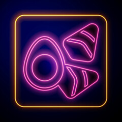 Glowing neon Chicken egg with vegerables icon isolated on black background. Vector