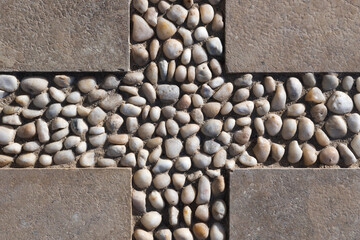 Decorative flooring pattern with concrete blocks and pebble