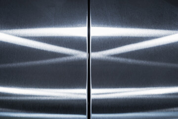 Brushed stainless steel wall with reflections pattern