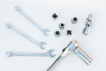 Large group of wrenches, professional kit, different wrenches on the white background
