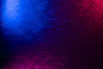 Color light overlay. Blur led glow. Electric radiance. Defocused neon blue pink purple color curves texture on dark black abstract background.