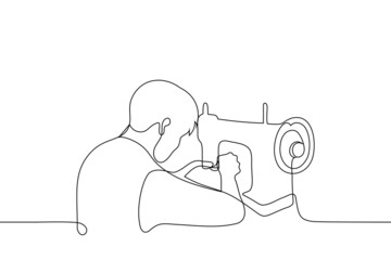 man sitting at vintage sewing machine - one line drawing vector. concept of artisan creates handicrafts, lover of sewing and repairing things, craftsman makes craft items - obrazy, fototapety, plakaty