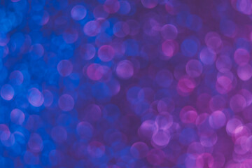 Bokeh color gradient. Blur light overlay. Ultraviolet illumination. Defocused neon blue purple pink glow round bubbles on fluorescent abstract background.