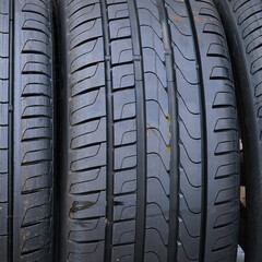 New black car tires close-up. Tire tread