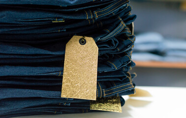 Close up of blue jeans on others with copy space, Various jeans on others with space for text, Clothes sale concept