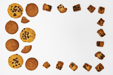 Homemade cookies with chocolate and nuts on a white background are highlighted with the composition.