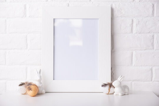 Mock up Photo frame near a white brick wall with Easter decor.