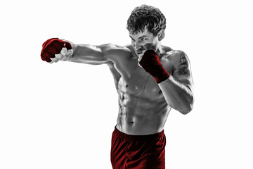 Studio shot of silhouette boxer who training, practicing jab on white background. Red sportswear. 