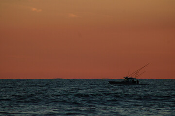 fishing boat at sunset
