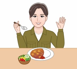食事をしている若い男性