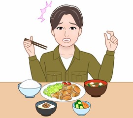 食事をしている若い男性