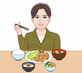 食事をしている若い男性
