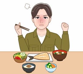 食事をしている若い男性