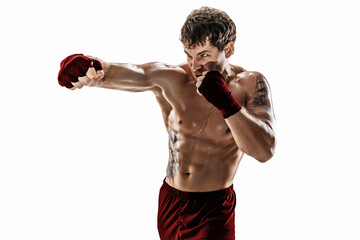 Studio shot of kickboxer who training, practicing jab on white background. Red sportswear