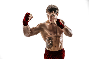 Fototapeta na wymiar Studio shot of kickboxer who training, practicing uppercut on white background. Red sportswear