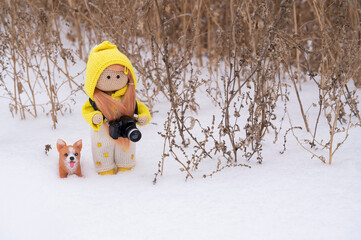 Toys, dolls in the snow.