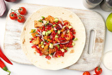 Concept of tasty food with taco on white background
