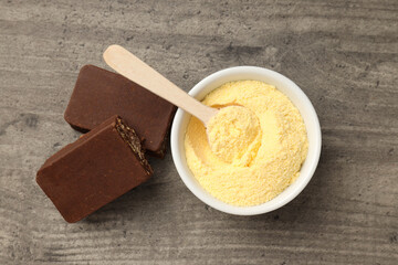 Concept of sports nutrition on gray wooden background