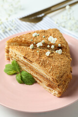 Concept of tasty dessert with honey cake, close up