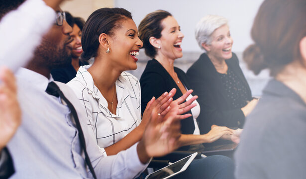 Applauding The Best Seminar Lecturer. Cropped Shot Of A Diverse Group Of Businesspeople Sitting And Clapping While In The Office During The Day.