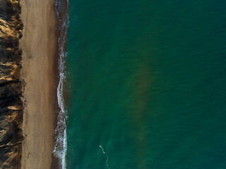 Aerial view of sandy beach and sea with waves, Top view, amazing nature background, beach and clear...