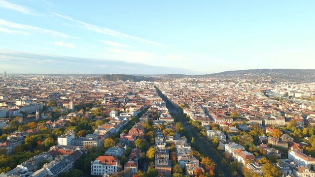 The sun is shining over the city of Budapest Hungary