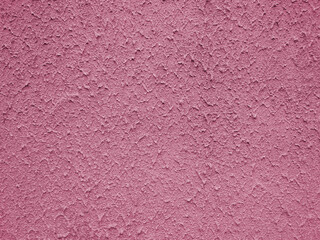 Rough blue plaster surface on the wall of the building. Plaster tecture close-up. Blue background.