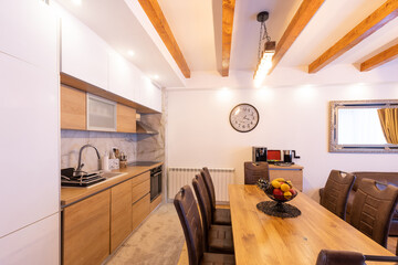 Kitchen and dining interior with wood details