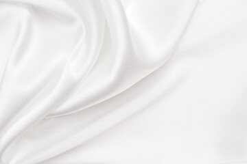 Smooth elegant white silk or satin luxury cloth texture can use as wedding background. Luxurious...
