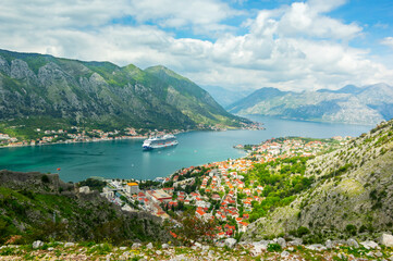 Landscape with old town, liner and mountains in Kotor Bay, Montenegro