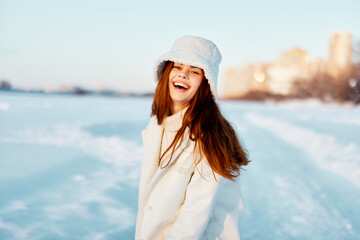 pretty woman in a white coat in a hat winter landscape walk travel
