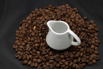 Fototapeta premium Small cup and coffee beans