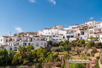 Fototapeta na wymiar FRIGILIANA, SPAIN - January 28 2022: Situated in South of Spain, Frigiliana is a touristic travel destination, a village situated on the hills, with white houses, small roads. Typically Andalusian 