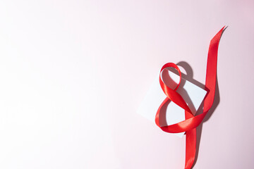 White podium and red ribbon 8 shape for International Woman Day background.Copy space