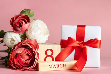 Flower and gift box for  on pink background for 8 March International Woman Day greeting card.