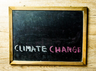 Climate change word with copy space on black board, in studio Chiangmai Thailand.