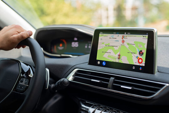 Kiev, Ukraine July 15, 2021. Car navigation system screen with map in modern interior of Peugeot 3008 auto.