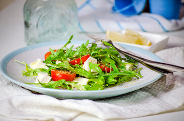 Arugula salad with feta cheese and cherry tomatoes