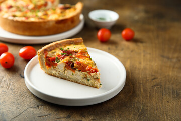 Homemade chicken quiche with tomatoes and pepper	