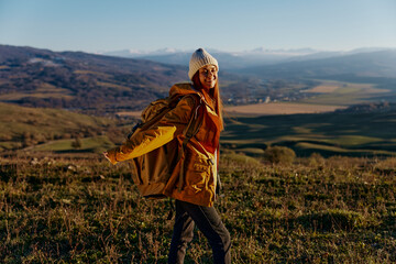 woman traveler backpacking trip to mountains landscape Fresh air