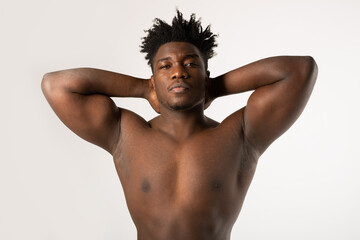 A strong African man with an athletic figure with muscles	
