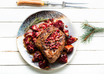 Pork meat fried with pomegranate
