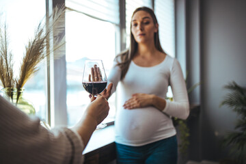 Pregnant woman refusing to drink alcohol. No Alcohol. Pregnant Lady Gesturing Stop To Offered Glass...