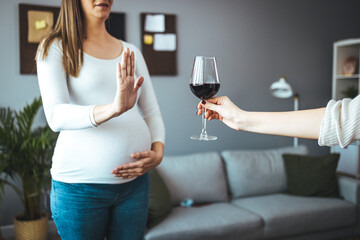 Pregnant woman refusing to drink alcohol. No Alcohol. Pregnant Lady Gesturing Stop To Offered Glass...
